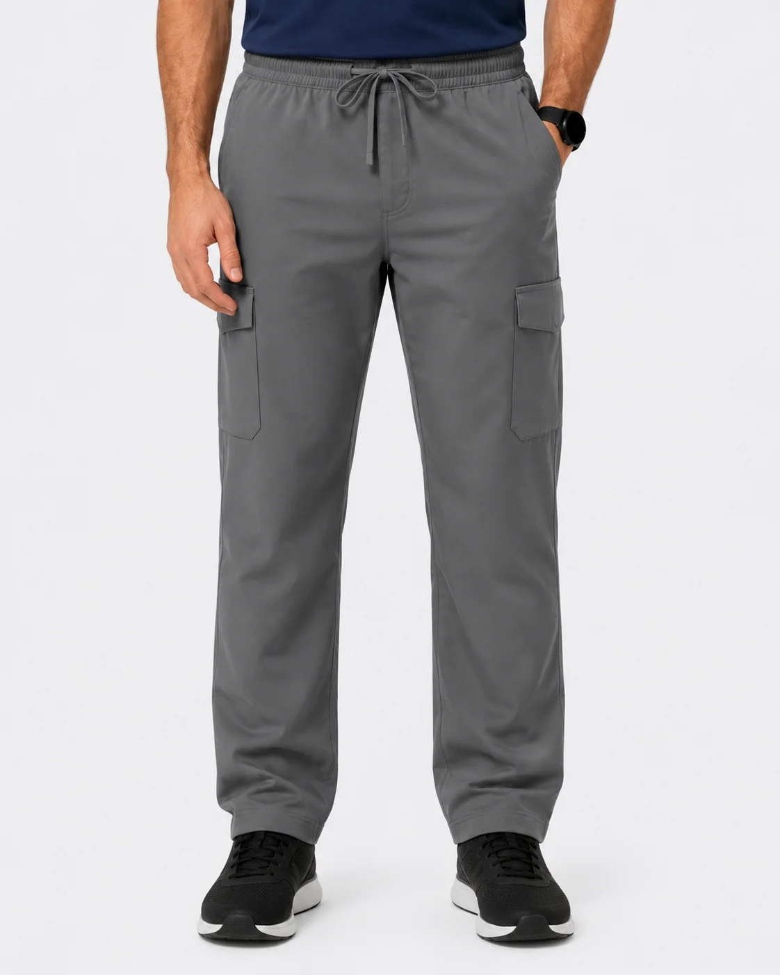 Grey cargo scrub pants with side pockets and black sneakers