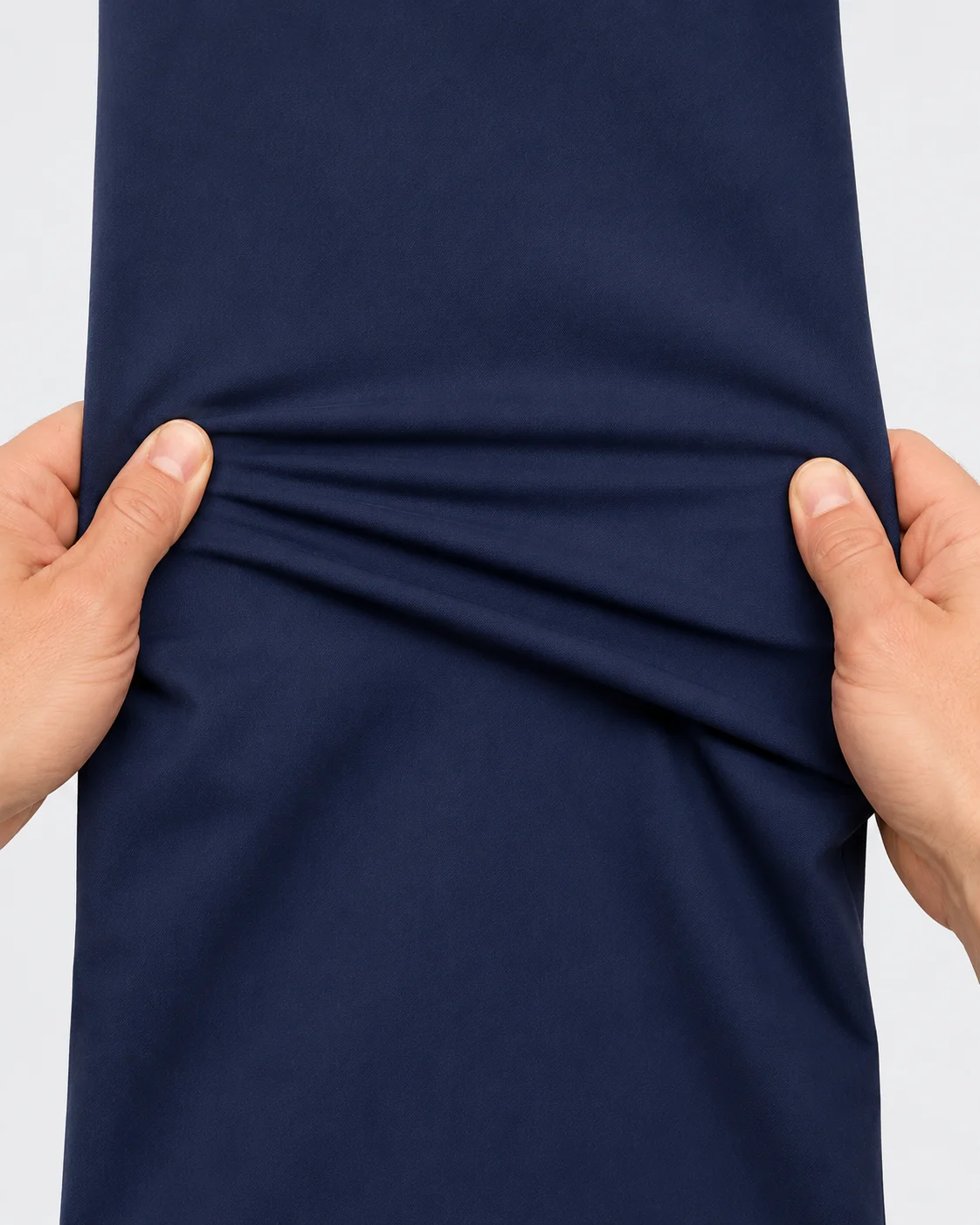 Close-up of navy scrub fabric showing stretch and flexibility